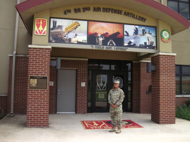      As one of this year’s Army Green to Gold Active Duty Option candidates, Staff Sgt. Brandi Brooks, pictured in front of 4th Battalion, 3rd Air Defense Artillery Headquarters, will begin fall classes Aug. 3, 2020, at Bowie State University in Maryland. Brooks is on track to complete her bachelor’s degree in communications there, and be commissioned an Army second lieutenant in 2022.
                          