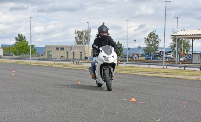 WACKERNHEIM, Germany - Sgt. 1st Class Joshua Queen, with the 212th Combat Support Hospital in Kaiserlautern, weaves around cones during the Basic Rider Course July 28 at McCully Barracks. Soldiers must pass the BRC to be able to operate a motorcycle while stationed in Europe.