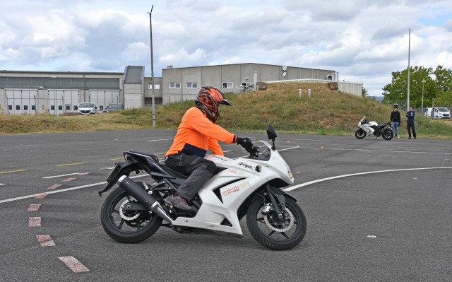 WACKERNHEIM, Germany - Stefan Bockisch, instructor for the Army’s motorcycle safety courses, demonstrates how to lean the bike when making a turn during the Basic Rider Course July 28 at McCully Barracks. Soldiers must pass the BRC to be able to...