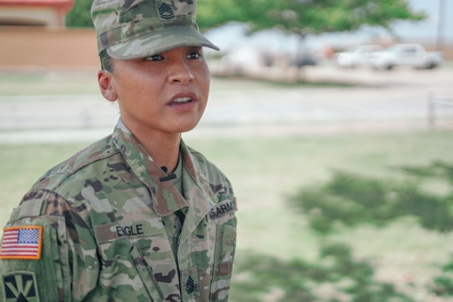 Sgt. 1st Class Denize Engle responds to a question posed by a KSWO-TV reporter, about her role in responding to a vehicle accident July 16, 2020, on Interstate 44. Engle, an Advanced Leader Course instructor at the NCO Academy at Fort Sill,...