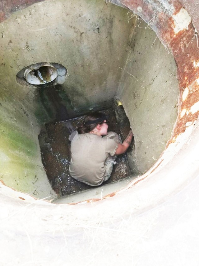 Spc. Diana Velez, a Fort Polk Veterinary Treatment Facility vet technician, climbed down another sewer manhole in an effort to find the kitten in need of rescue.