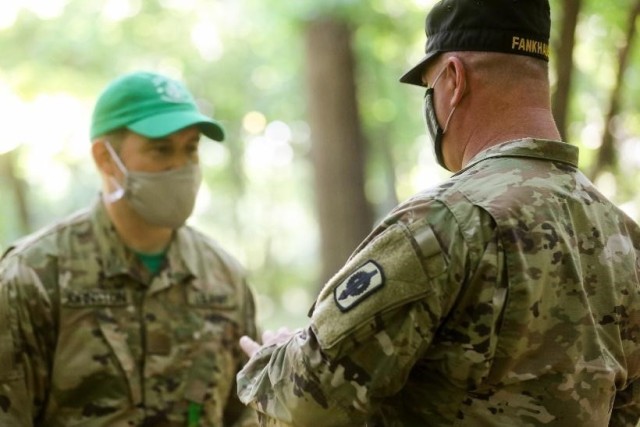 Chief Warrant Officer 4 Ronnie Fankhauser, senior training, advising and counseling officer, gives valuable advice to Warrant Officer Candidate Johnston about leadership skills and potential improvements after completing a leadership role in one...