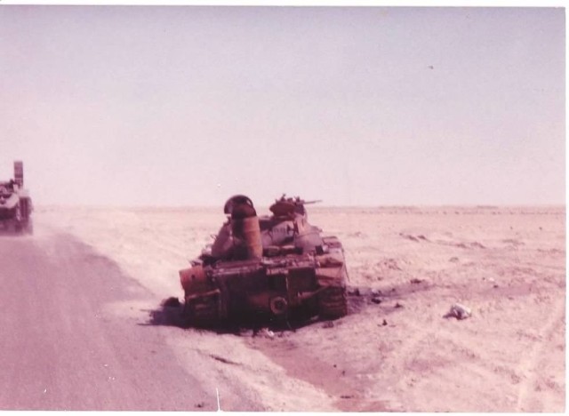 A destroyed Iraqi tank sits along a desert road in Saudi Arabia during the Gulf War. The conflict&#39;s 30th anniversary was on Aug. 2, 2020. 