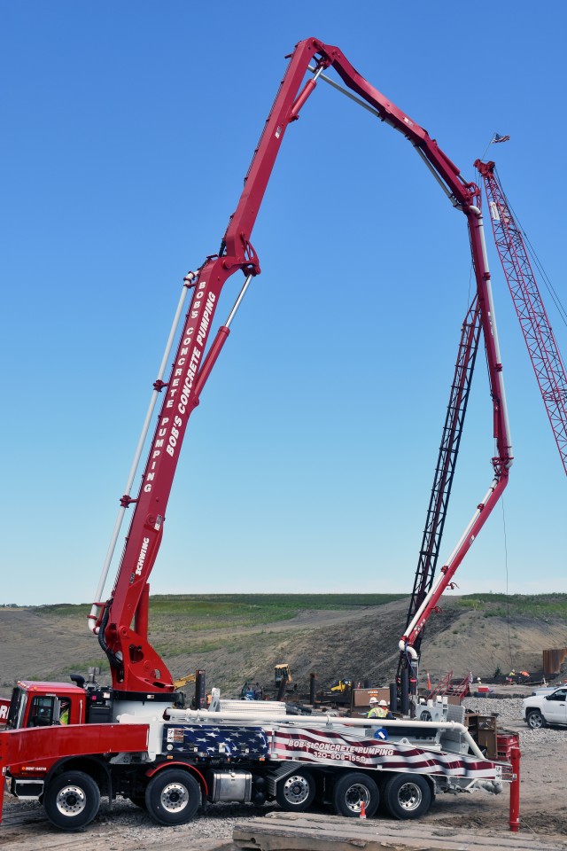 A crew of workers places the first loads of concrete at the diversion inlet site near Horace, North Dakota, July 27. The Corps of Engineers, St. Paul District, is working in partnership with the cities of Fargo, North Dakota; West Fargo, North...