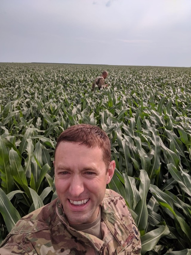 Air Force Capt. Brian Fagan waits for aircraft to fly over a drop zone in Romania, June 15, 2019.