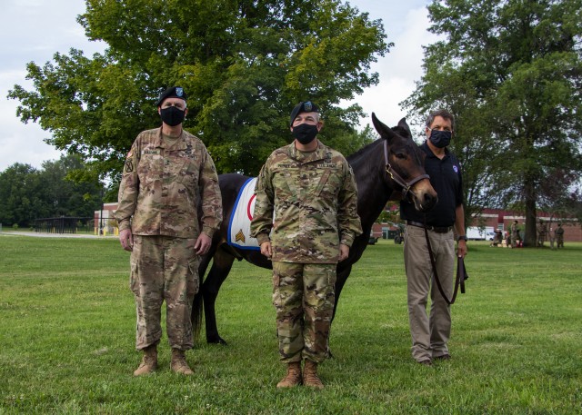 Maj. Gen. John P. Sullivan, commanding general of 1st Theater Sustainment Command, alongside Command Sgt. Maj. Michael J. Perry III, senior enlisted advisor, 1st TSC pose with the 1st TSC mascot, Sgt. Blackjack, at Fort Knox, July 28, 2020. (U.S. Army photo by Spc. Zoran Raduka, 1st TSC Public Affairs)