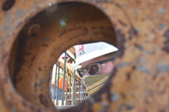 Jake Fall, St. Paul District concrete materials engineer, observes the first placement of concrete at the site near Horace, North Dakota, July 27. The Corps of Engineers, St. Paul District, is working in partnership with the cities of Fargo, North...