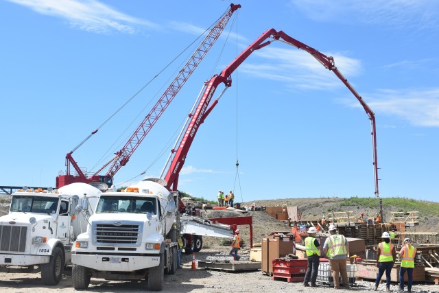 A crew of workers places the first loads of concrete at the diversion inlet site near Horace, North Dakota, July 27. The Corps of Engineers, St. Paul District, is working in partnership with the cities of Fargo, North Dakota; West Fargo, North...