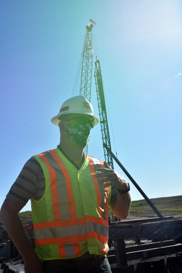 Duane Perkins, St. Paul District lead structural engineer for the diversion inlet structure, observes the first placement of concrete at the site near Horace, North Dakota,July 27. The Corps of Engineers, St. Paul District, is working in...