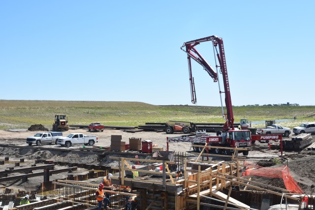 A crew of workers places the first loads of concrete at the diversion inlet site near Horace, North Dakota, July 27. The Corps of Engineers, St. Paul District, is working in partnership with the cities of Fargo, North Dakota; West Fargo, North...