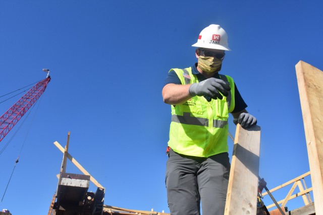Jake Fall, St. Paul District concrete materials engineer, observes the first placement of concrete at the site near Horace, North Dakota, July 27. The Corps of Engineers, St. Paul District, is working in partnership with the cities of Fargo, North...