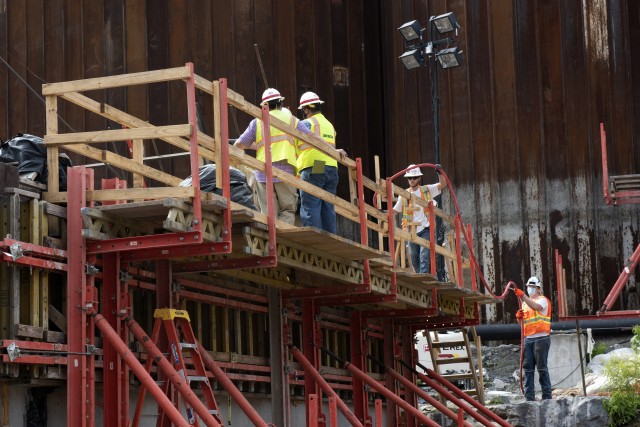 Corps construction representatives oversee Shimmick contractors preparing to drill holes July 21, 2020 to install reinforcing steel in preparation to place more concrete for a monolith. The U.S. Army Corps of Engineers Nashville District is...