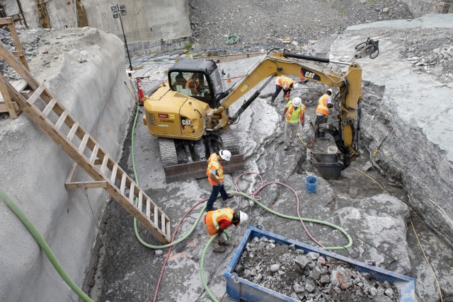 Shimmick construction workers prepare the riverbed inside a coffer dam July 21, 2020 in preparation to place more concrete for a monolith. The U.S. Army Corps of Engineers Nashville District is constructing a new navigation lock as part of the...