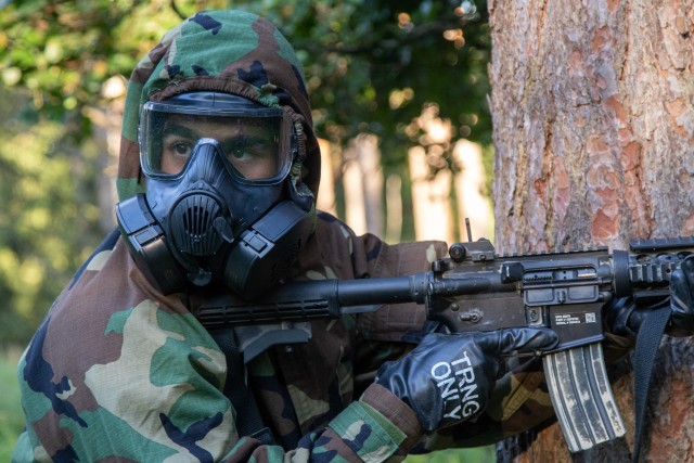 U.S. Army 1st Lt. Quinn Gutierrez, engineer officer, 173rd Airborne Brigade Combat Team, reacts to contact during the chemical, biological, radiological and nuclear lane on day six of the U.S. Army Europe European Best Warrior Competition at...