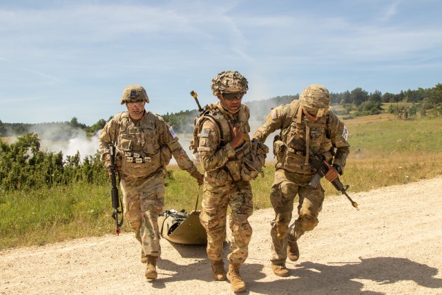 Competitors pull a sked litter during the medical evacuation portion of the U.S. Army Europe European Best Warrior Competition at Hohenfels Training Area, Germany, July 29, 2020. The competition is an annual event with competitors assigned to...