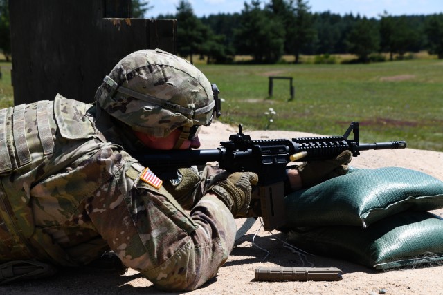 U.S. Army Spc. Justin Rivard assigned to 10th Army Air and Missile Defense Command fires at the M-16 qualification range during the U.S. Army Europe European Best Warrior Competition at U.S. Army Garrison Grafenwohr Training Area, Germany, July...