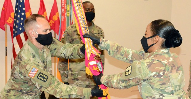 FORT LEE, VA. -- Incoming Commander Lt. Col. Aaron T. Workman takes the 16th Ordnance Battalion flag from 59th Ordnance Brigade Commander Col. Clydea M. Prichard-Brown during a change of command ceremony in Ball Auditorium July 10.