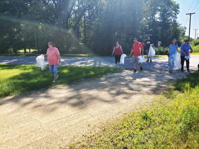 Members of the Fort McCoy Sgt. Audie Murphy Club Chapter, their family members, and others from Fort McCoy, Wis., participate in a one-hour cleanup effort July 16, 2020, along the Elroy-Sparta Bike Trail in Sparta, Wis. More than 30 people...