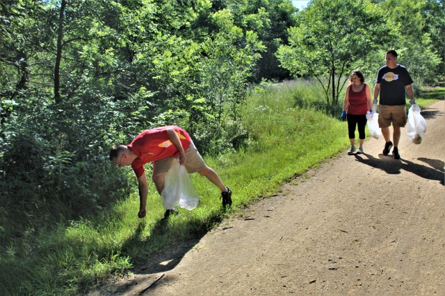 Members of the Fort McCoy Sgt. Audie Murphy Club Chapter, their family members, and others from Fort McCoy, Wis., participate in a one-hour cleanup effort July 16, 2020, along the Elroy-Sparta Bike Trail in Sparta, Wis. More than 30 people...