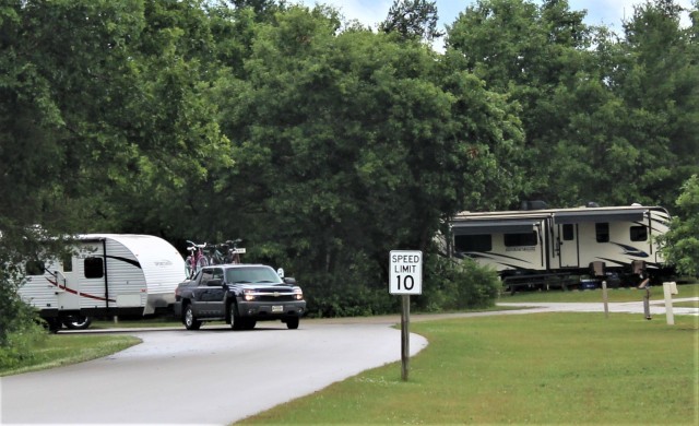 A camper is shown July 9, 2020, at Pine View Campground at Fort McCoy, Wis. The campground first reopened May 22, 2020, and hundreds of people have since returned to camping at the campground. (U.S. Army Photo by Scott T. Sturkol, Public Affairs...