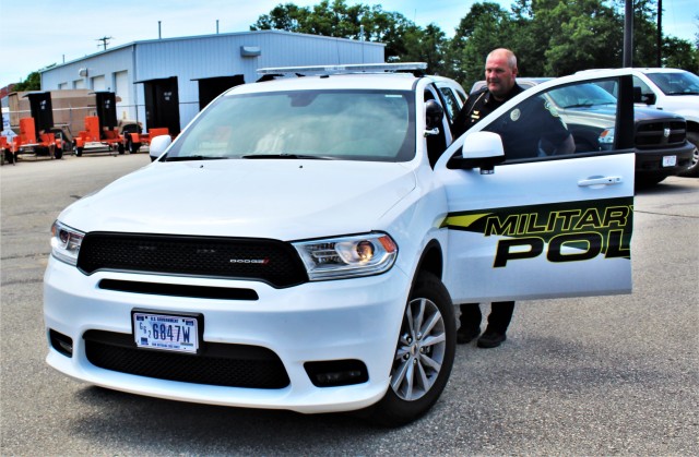 Police Sgt. Kevin Eckelberg gets into a new police cruiser June 25, 2020, assigned to the Fort McCoy Directorate of Emergency Services Police Department at Fort McCoy, Wis. The department received this first Dodge Durago-based cruiser for use...