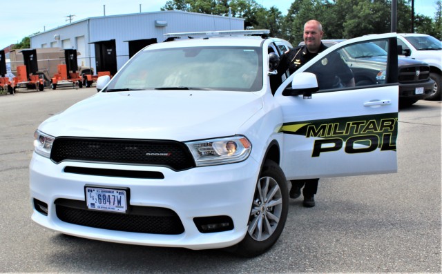 Police Sgt. Kevin Eckelberg gets into a new police cruiser June 25, 2020, assigned to the Fort McCoy Directorate of Emergency Services Police Department at Fort McCoy, Wis. The department received this first Dodge Durago-based cruiser for use...