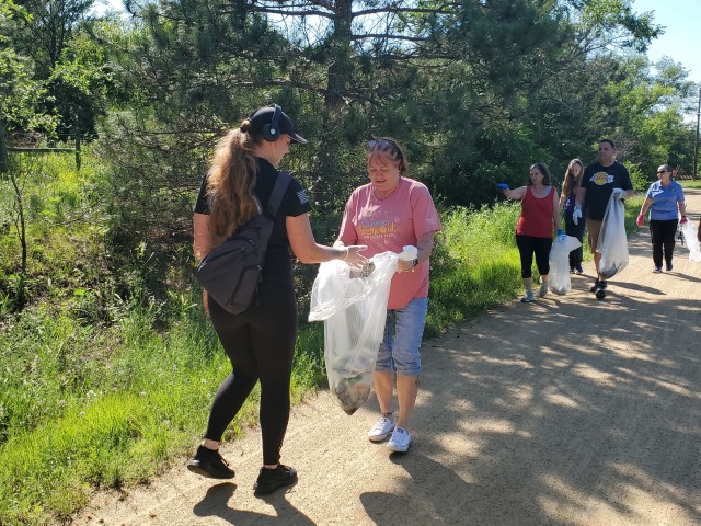 Members of the Fort McCoy Sgt. Audie Murphy Club Chapter, their family members, and others from Fort McCoy, Wis., participate in a one-hour cleanup effort July 16, 2020, along the Elroy-Sparta Bike Trail in Sparta, Wis. More than 30 people...