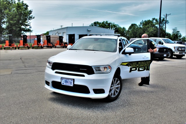 Police Sgt. Kevin Eckelberg gets into a new police cruiser June 25, 2020, assigned to the Fort McCoy Directorate of Emergency Services Police Department at Fort McCoy, Wis. The department received this first Dodge Durago-based cruiser for use...