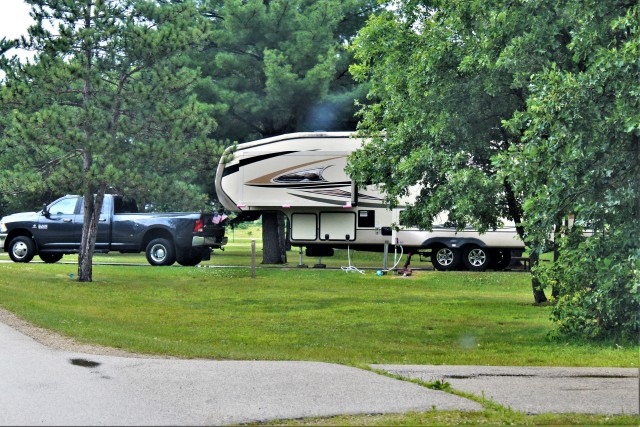 A camper is shown July 9, 2020, at Pine View Campground at Fort McCoy, Wis. The campground first reopened May 22, 2020, and hundreds of people have since returned to camping at the campground. (U.S. Army Photo by Scott T. Sturkol, Public Affairs...