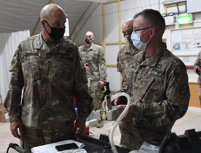 U.S. Army Col. Jon DuBose (right), brigade surgeon for the 30th Armored Brigade Combat Team, Task Force Spartan, assembles a ventilator for Brig. Gen. Thomas Spencer (left), deputy commanding general for support for Task Force Spartan Shield and...
