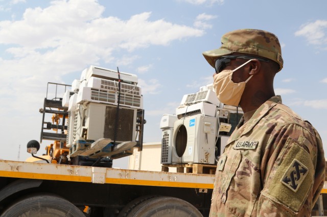 U.S. Army Spc. Eric S. Shepherd, 207th Regional Support Group services NCO, supervises the disposal of broken equipment at Al Asad Air Base, Iraq, July, 10, 2020. The Army Reserve unit provided life
...