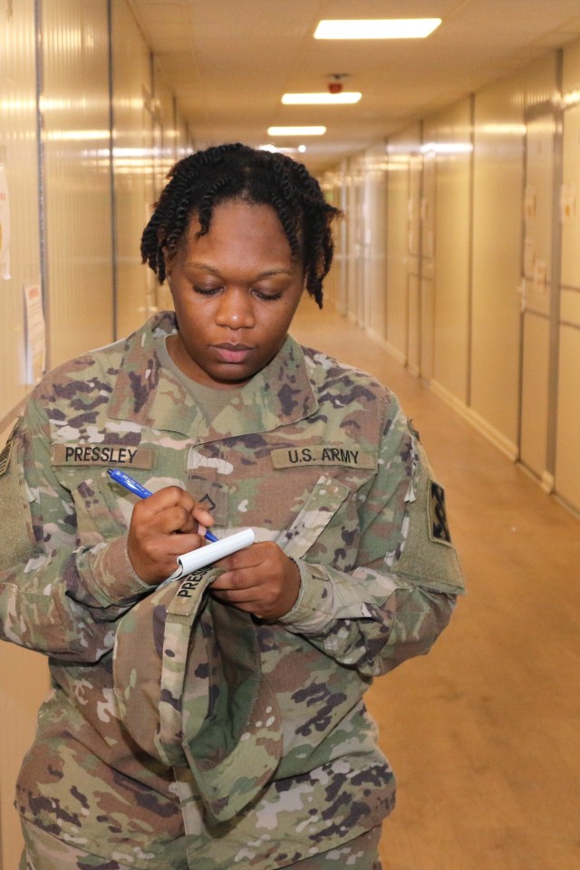 U.S. Army Pfc. Jada Pressley, 207th Regional Support Group, conducts an inspection of housing units at Erbil Air Base, Iraq, on Dec. 9, 2019 as part of the Mayor's Cell. The Army Reserve unit has acted as the Base Operating Logistics Integrator...