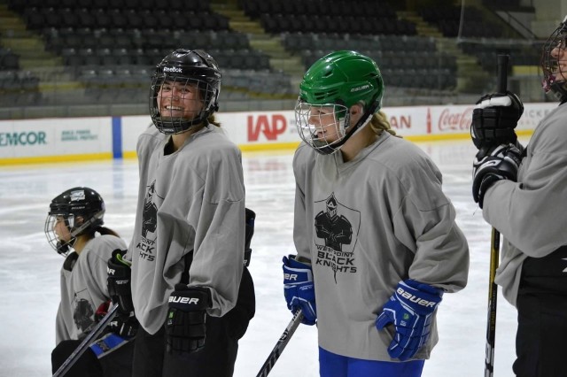 Class of 2021 Cadets Leighton McAlpin (left) and Emily Johnsrud at hockey practice at Tate Rink.