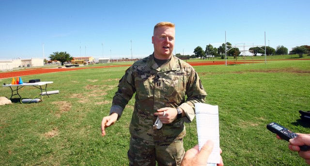 Capt. Jordan Henrickson speaks with a local media representative about his ballooning hobby. The commander of C Battery, 5th Battalion, 5th Air Defense Artillery at Fort Sill, Oklahoma, said his interest in ballooning began in college.