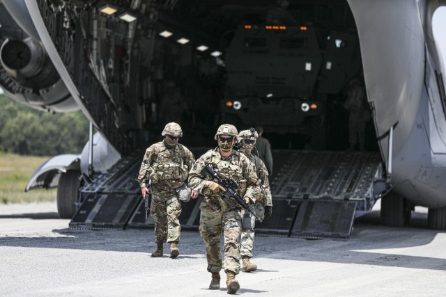 Soldiers assigned to 3rd Battalion, 27th Field Artillery Regiment (HIMARS), disembark from a C-17 Globemaster III, en route to a simulated fire mission, at Fort A.P. Hill Landing Zone, Virginia, July 20, 2020. These 3-27th FAR (HIMARS) crews are conducting artillery raid exercises in preparation for future large scale combat operations. 
(U.S. Army Photo by Spc. Daniel J. Alkana, 22nd Mobile Public Affairs Detachment)
