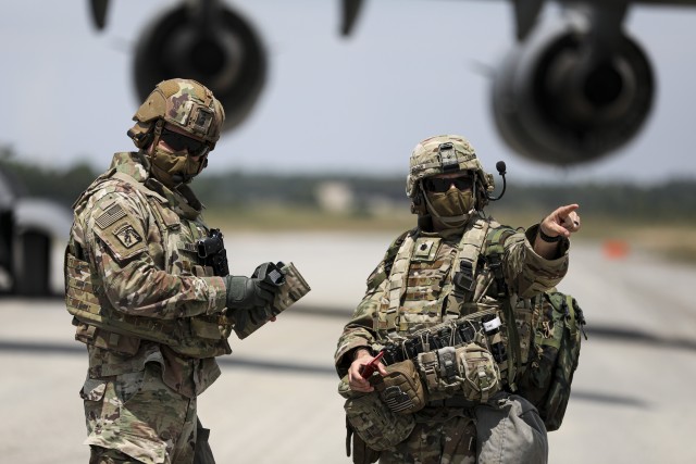 Lt. Col. John Bradley, commander, 3rd Battalion, 27th Field Artillery Regiment (HIMARS), directs personnel after disembarking from a C-17 Globemaster III, in Fort A.P. Hill, Virginia, for an artillery raid exercise on July 20, 2020. Crews from the...