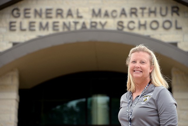 MacArthur Elementary School Counselor Sue Walker, seen here in front of the school July 31, received the 2020 Kansas School Nurses Organization Recognition Award. The award is presented to an organization, agency, group or individual who continuously supported or uniquely contributed in the promotion of KSNO. Walker was nominated by MacArthur School Nurse Melinda McConnell, who said she can always count on Walker's support to help care for the physical, emotional and mental needs of the students. Photo by Prudence Siebert/Fort Leavenworth Lamp