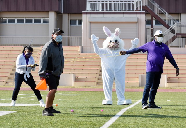 Lucinda Ward, far left, school liaison officer for U.S. Army Garrison Japan, gets ready to slingshot Easter eggs during the Easter Egg Sling at the Zama Middle High School football field, Camp Zama, Japan, April 11. At the time, Ward served as...