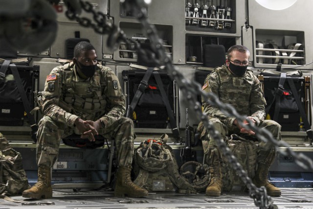 Soldiers assigned to 3rd Battalion, 27th Field Artillery Regiment (HIMARS), wait to disembark  from a C-17 Globemaster III, after arriving at  Fort A.P. Hill Landing Zone, Virginia, for an Artillery Raid, on July 20, 2020. These 3-27th FAR...