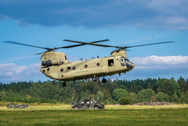 A CH-47 Chinook from B Co "Big Windy," 1-214th General Support Aviation Battalion lifts a 173rd Airborne Brigade tactical vehicle during Saber Junction 20 at Grafenwöhr Training on Aug. 5. (U.S. Army photo by Maj. Robert Fellingham)