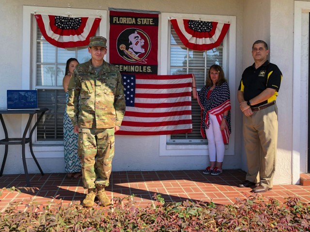 U.S. Army Reserve 2nd Lt. Curtis Rahman poses with his parents Robin and Emir during his virtual commissioning ceremony held at his parent's home in Florida, May 2, 2020. 2nd Lt. Rahman is a cyber officer with the Army Reserve Cyber Operations...