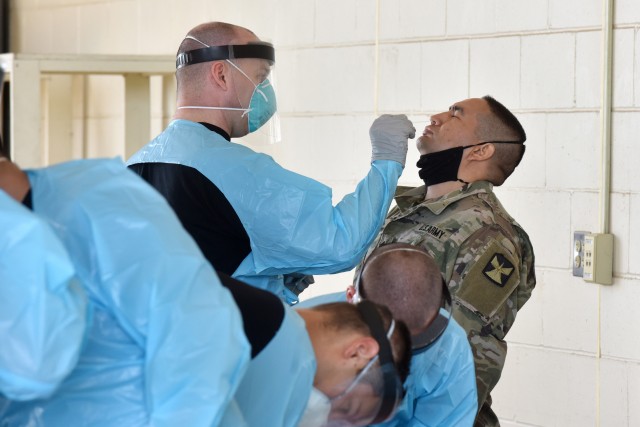 Isolation Support Facility (ISF) personnel of the 581st ASMC, 61st MMB and 1st Medical Brigade out of Ft. Hood, Texas and a Mobile Medical Laboratory provided by FORSCOM work with Medics from the Minnesota National Guard on Camp Ripley July 28, 2020 to test Soldiers prior to mobilization for training. The testing which began June 18, 2020 for Task Force Viking (1/34th ABCT) completed just under 4,000 tests aiding the process to reduce training distractions or health risks due to COVID-19. (U.S. Army photo by Tony Housey)