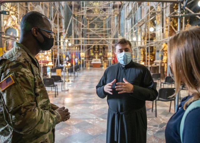 Father Mykhalchuk Taras, the senior chaplain of the Armed Forces of Ukraine explains the history of Saints Peter and Paul Garrison Church to Task Force Illini Chaplain (Maj.) Vincent Lambert through a translator during their meeting at the Garrison Church in Lviv, Ukraine, Aug. 5. (Photos by Army Cpl. Shaylin Quaid, JMTG-U Public Affairs)
