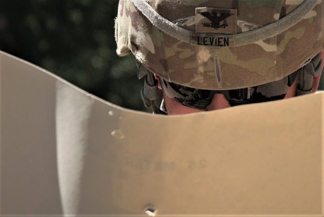 Commander of the 7th Mission Support Command and deputy commander of the 21st Theater Support Command, Col. Douglas A. LeVien, checks his target during a M17 pistol range qualification conducted by the 773rd Civil Support Team, 7th Civil Support...