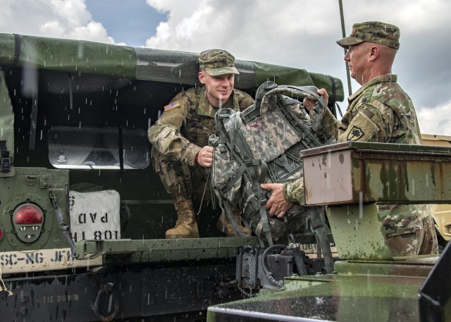 South Carolina National Guard Soldiers from the 108th Public Affairs Detachment in Eastover, S.C., load gear into a Humvee in preparation to support partnered civilian agencies and safeguard the citizens of the state before the onset of Hurricane...