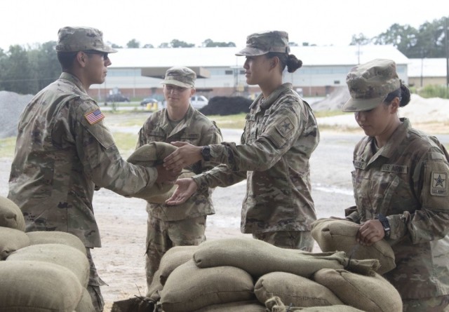 Trainees at Fort Jackson, S.C., stack sandbags to be used throughout the hurricane season on Sept. 5, 2019. The Army recently introduced a new directive to prepare the service&#39;s installations against the growing threat of climate change.  