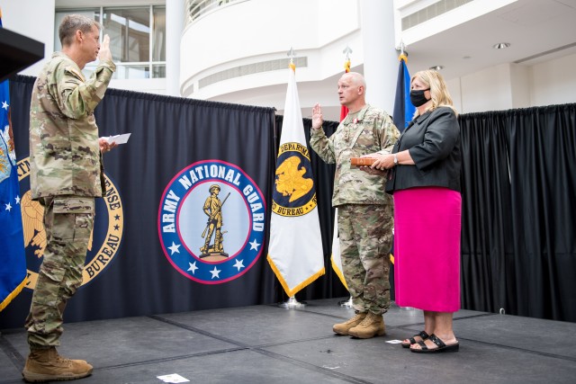 Chief of the National Guard Bureau Gen. Daniel R. Hokanson administers the oath of office to Lt. Gen. Jon A. Jensen as the 22nd director of the Army National Guard on Monday at the Temple Army National Guard Readiness Center in Arlington, Va.