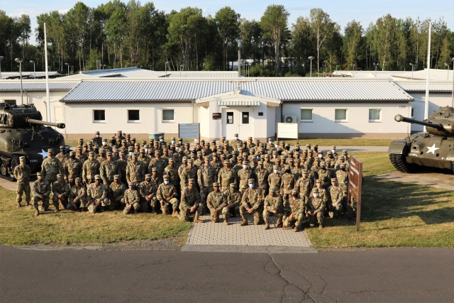 U.S. Army Reserve Soldiers of the 7th Mission Support pose in front of the M4 Sherman Firefly and M26 Pershing tanks located at the 7th Army Noncommissioned Officer Academy during exercise Forward and Ready 20 at United States Army Garrison...