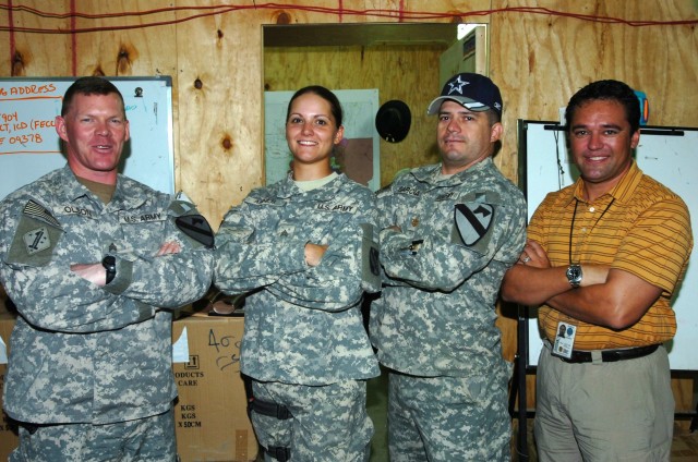 U.S. Army Reserve Sgt. Rachel Copeland (then under her maiden name Ahner) with coworkers during her Iraq deployment in 2007.