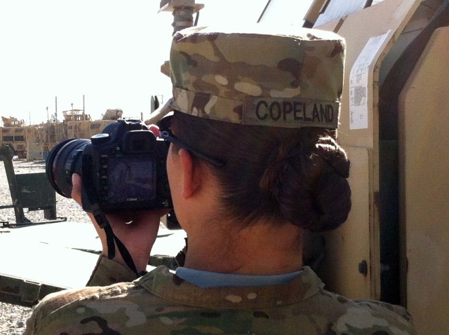 U.S. Army Staff Sgt. Rachel Copeland photographing events in Afghanistan during her 2014 deployment with the 982nd Combat Camera Company. 